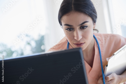 Nurse using computer in hospital photo