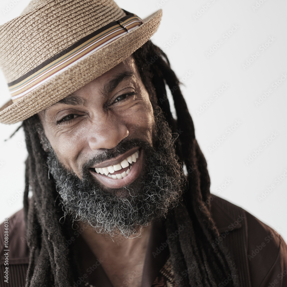 Portrait of smiling man with dreadlocks 