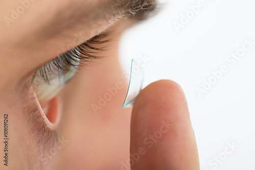 Man Putting Contact Lens In Eye