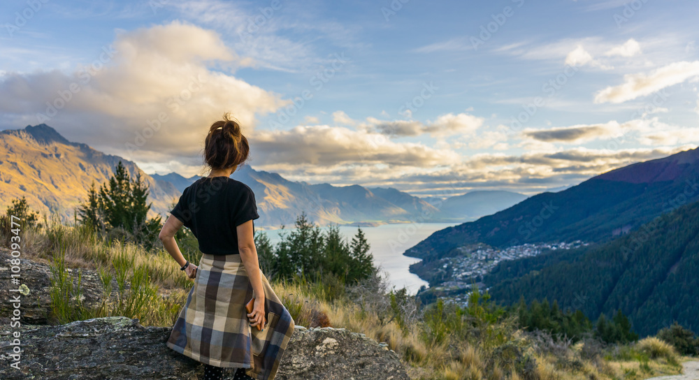 Woman traveler looking at Lake