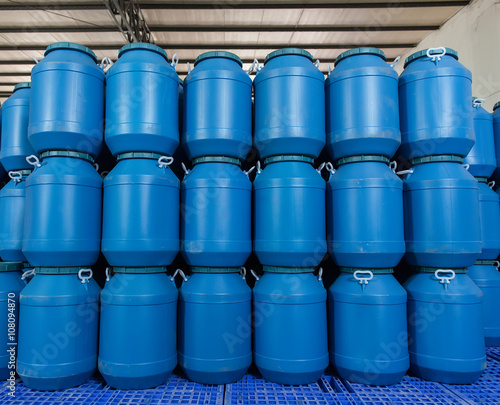 Blue Plastic barrels contain