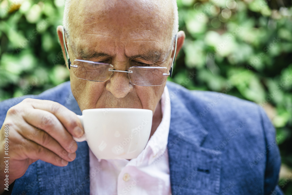 Hispanic businessman drinking cup of coffee Hispanic businessman drinking cup of coffee