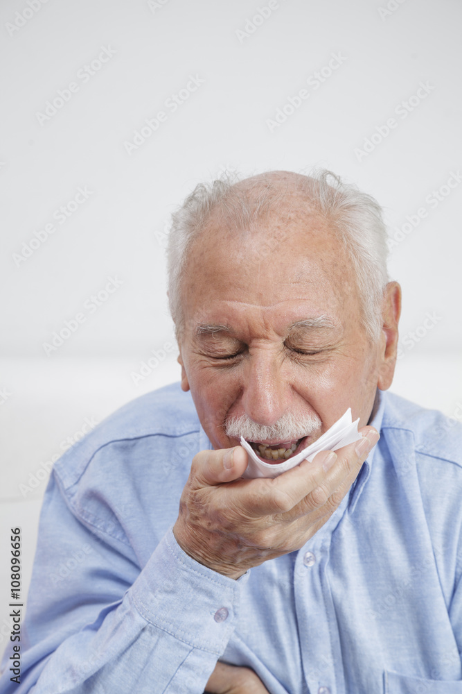 Elderly man with tissues Elderly man with tissues