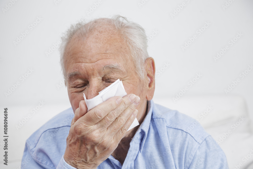 Elderly man with tissues