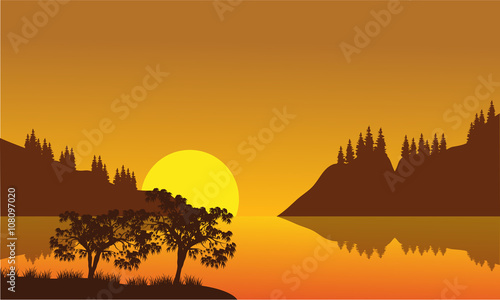 Silhouette of city and lake