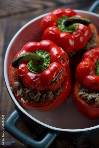 Baking dish with stuffed bell peppers, close-up, selective focus
