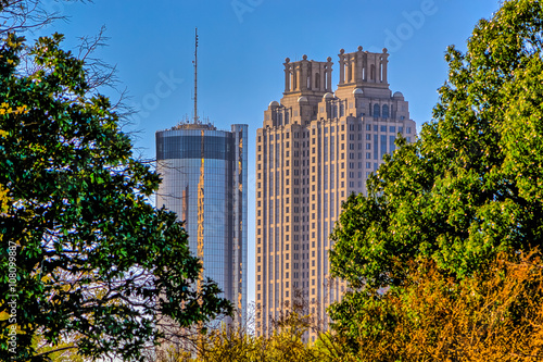 Atlanta cityscape buildings in between green trees 