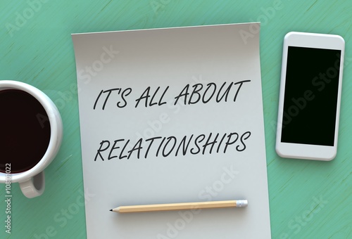 Its All About Relationships, message on paper, smart phone and coffee on table, 3D rendering photo