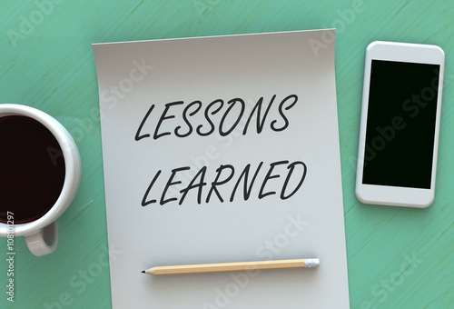 Tablou pe pânză Lessons Learned, message on paper, smart phone and coffee on table, 3D rendering