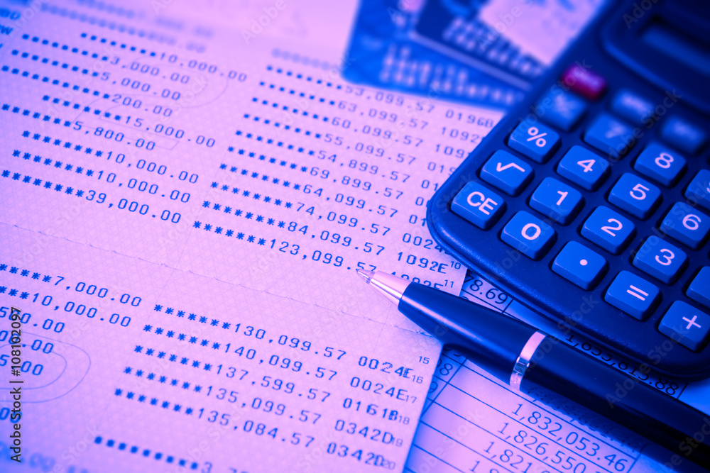 Book bank, credit cards, the calculator, a ball pen. Business finance concept. filter red and blue effect style picture. Book bank, credit cards, the calculator, a ball pen. Business finance concept. filter red and blue effect style picture.