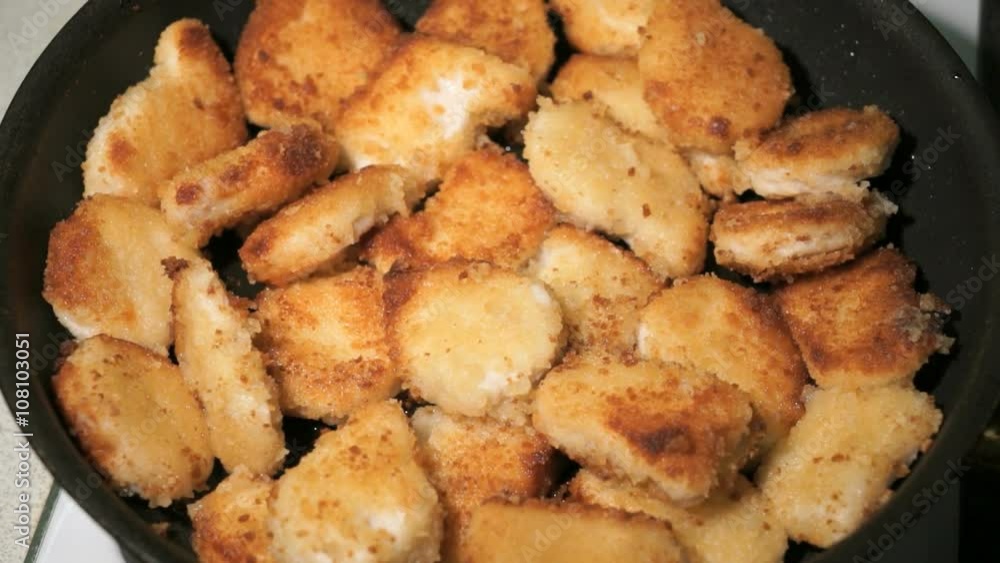 Batter-fried chicken meat nuggets is cooked on pan Batter-fried chicken meat nuggets is cooked on pan