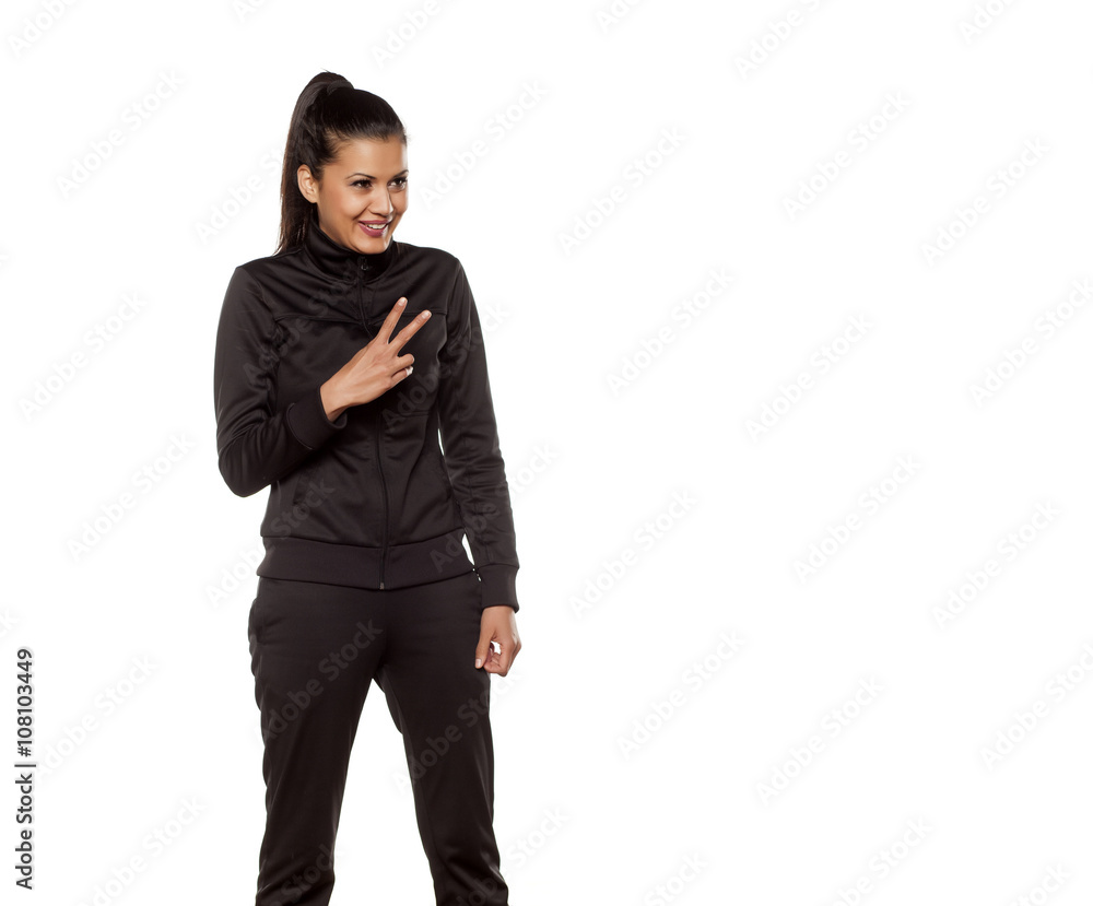 young pretty woman in tracksuits posing in the studio young pretty woman in tracksuits posing in the studio
