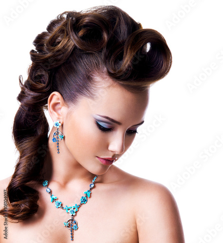 Profile portrait of a beautiful woman with creative hairstyle