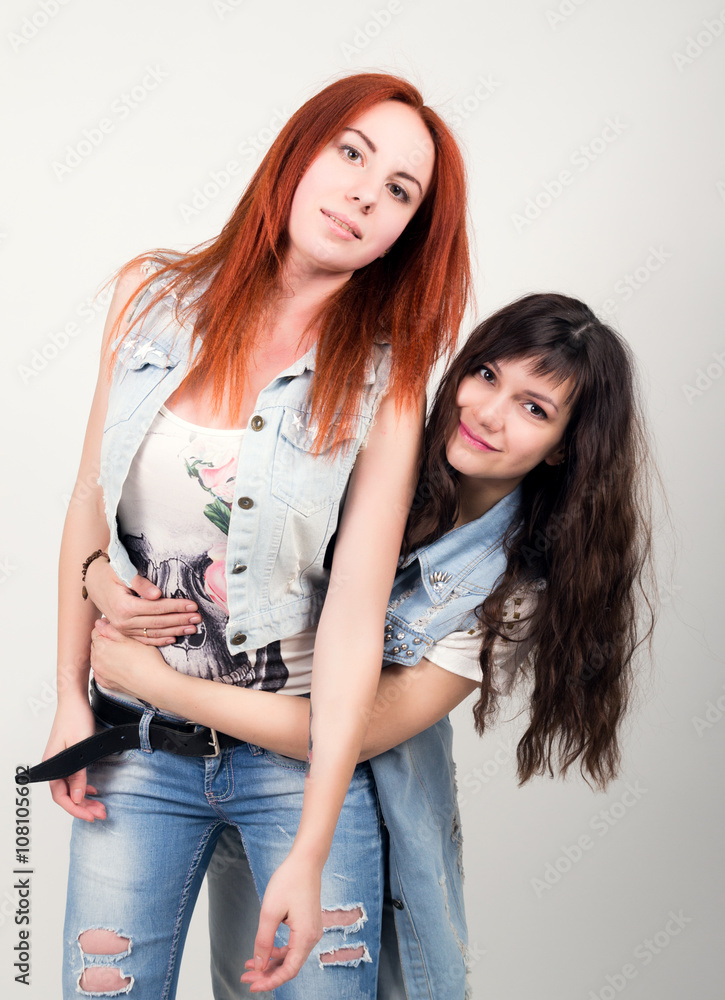 two girlfriends were offended, turned their backs to each other. different emotions. looking away after conflict at home two girlfriends were offended, turned their backs to each other. different emotions. looking away after conflict at home