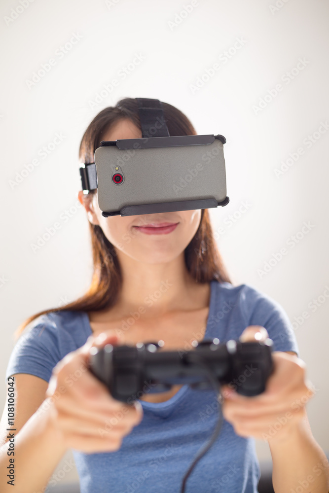 Woman play video game with VR device