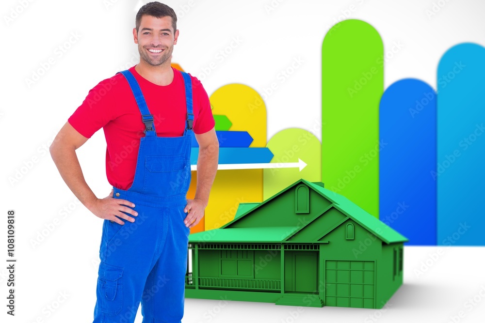 Composite image of happy handyman in overalls with hands on hip Composite image of happy handyman in overalls with hands on hip