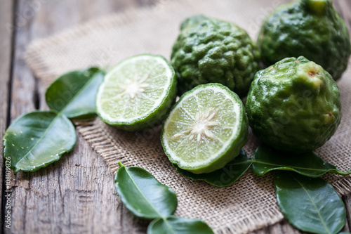 bergamot on sackcloth and wooden background