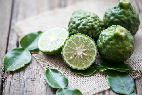 bergamot on sackcloth and wooden background photo