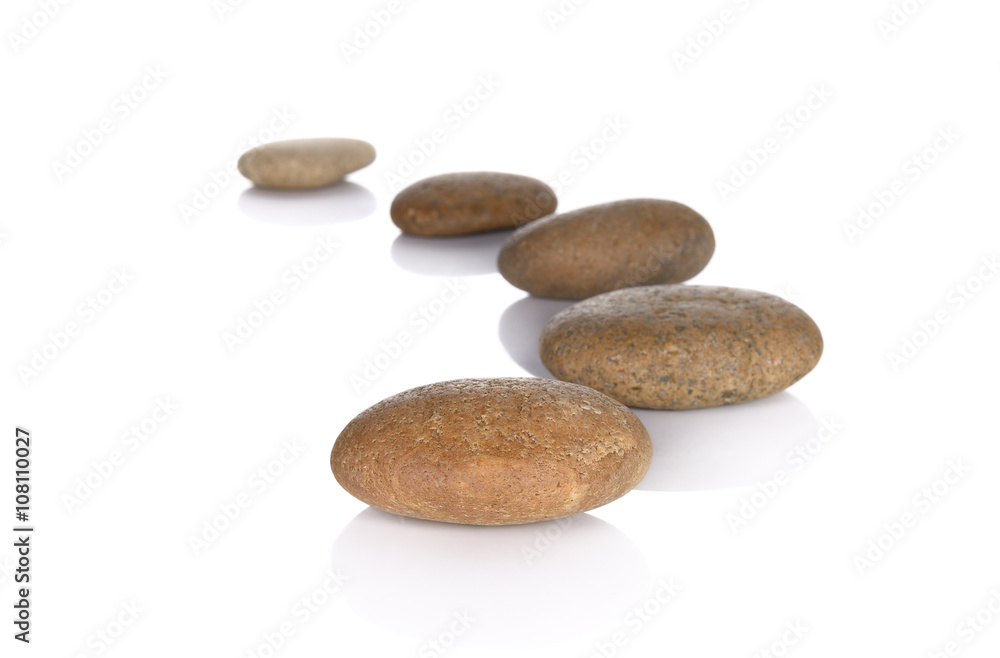 Row pebbles with copy space on white background Row pebbles with copy space on white background