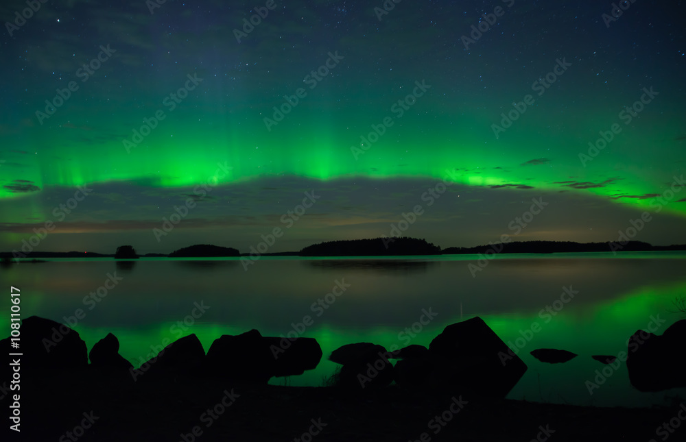 Scenic view of a lake landscape with northern lights