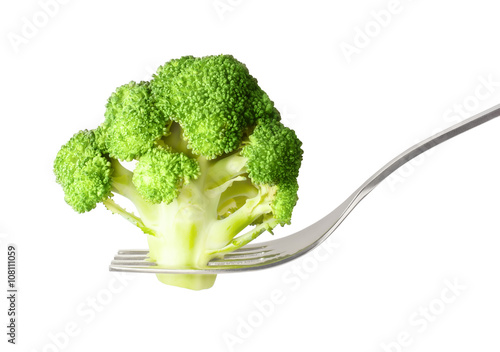 Fresh raw broccoli on fork isolated