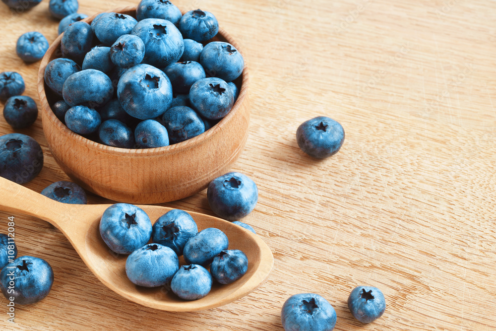Organic blueberries in bowl on wooden background. Close up, top view, high resolution product. Harvest Concept Organic blueberries in bowl on wooden background. Close up, top view, high resolution product. Harvest Concept
