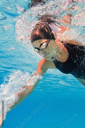 Swimming athlete, underwater view