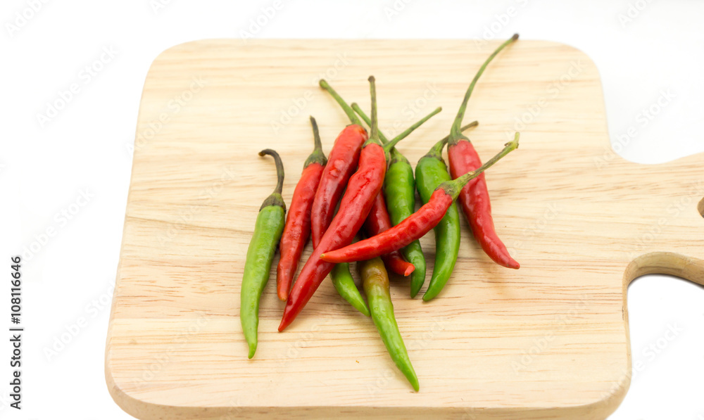 Chilli on wooden plate Chilli on wooden plate