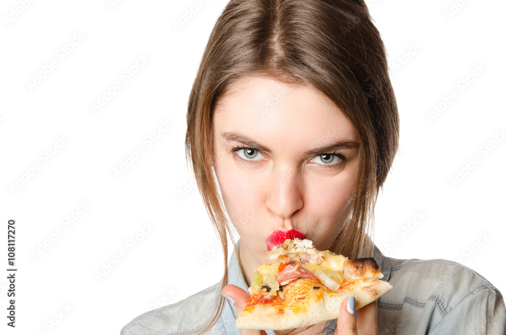 Pretty young sexy woman eating big slice of pizza standing on white background