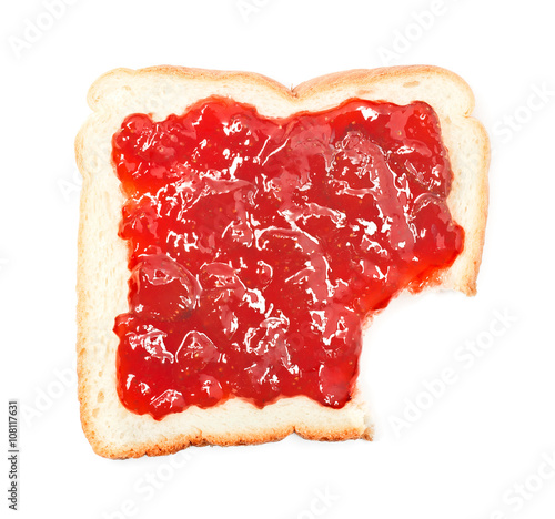 bite out of a slice of bread with strawberry jam