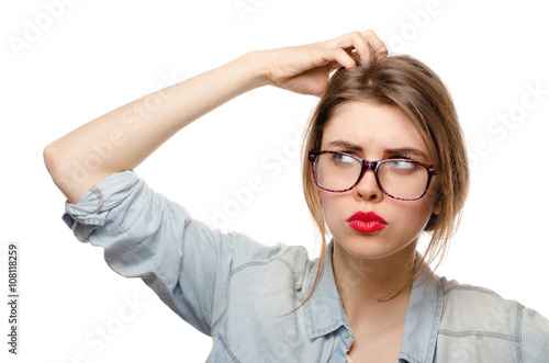 Closeup portrait of young woman scratching head. Thinking cogitative woman