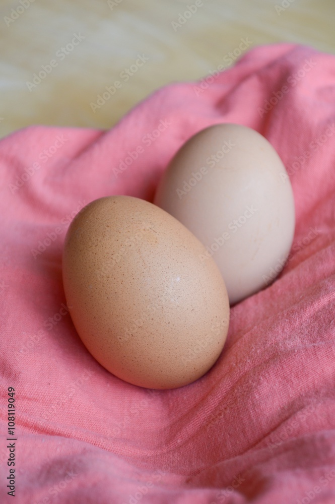 close up egg on pink fabric