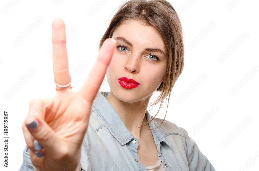 Happy beautiful young woman showing two fingers or victory gesture, isolated over white background Happy beautiful young woman showing two fingers or victory gesture, isolated over white background