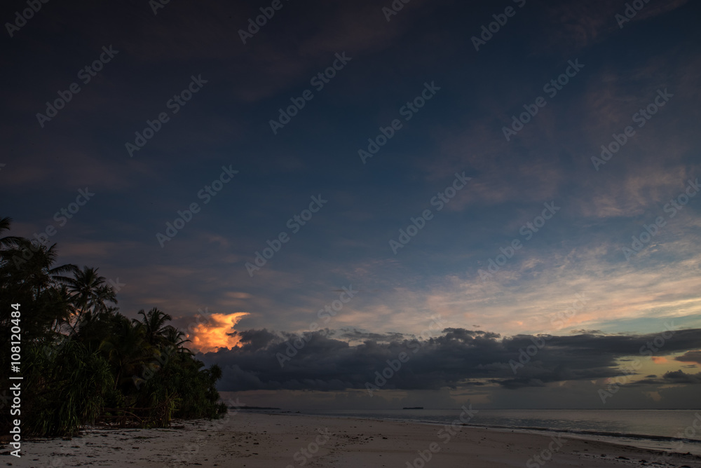 Incandescent sunrise on tropical beach