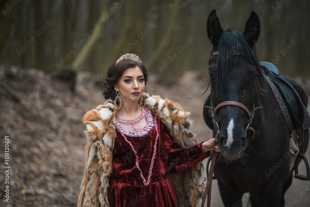 Obraz premium Princess with her horse in the woods