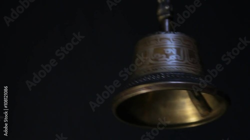 bronze bell on black background