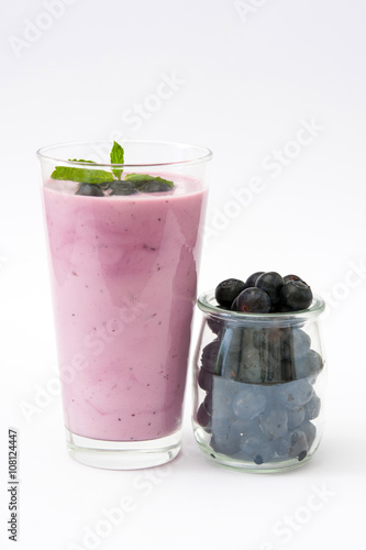 Fresh blueberry smoothie on white background 