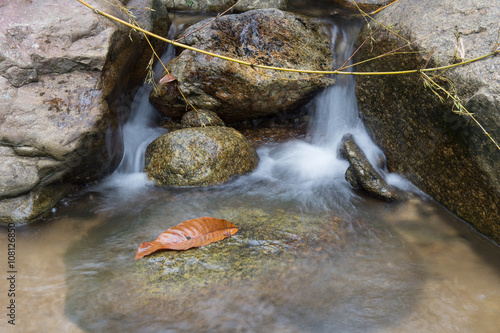 Un-focus image of Brook and rocks in the mountains at Kiriwong v photo