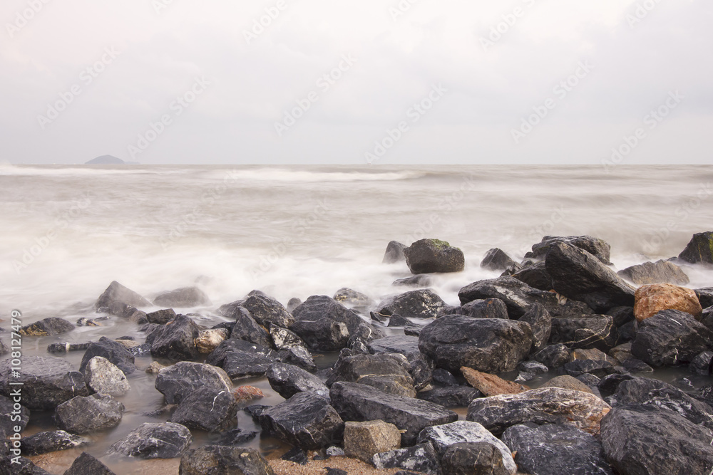 landscape of cloudy  sky and sea which have breakwater on windy day ; Songkhla Thailand (slow shutter speeds)