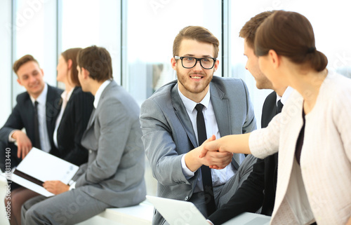 Wallpaper Mural Image of business partners handshaking after signing contract Torontodigital.ca