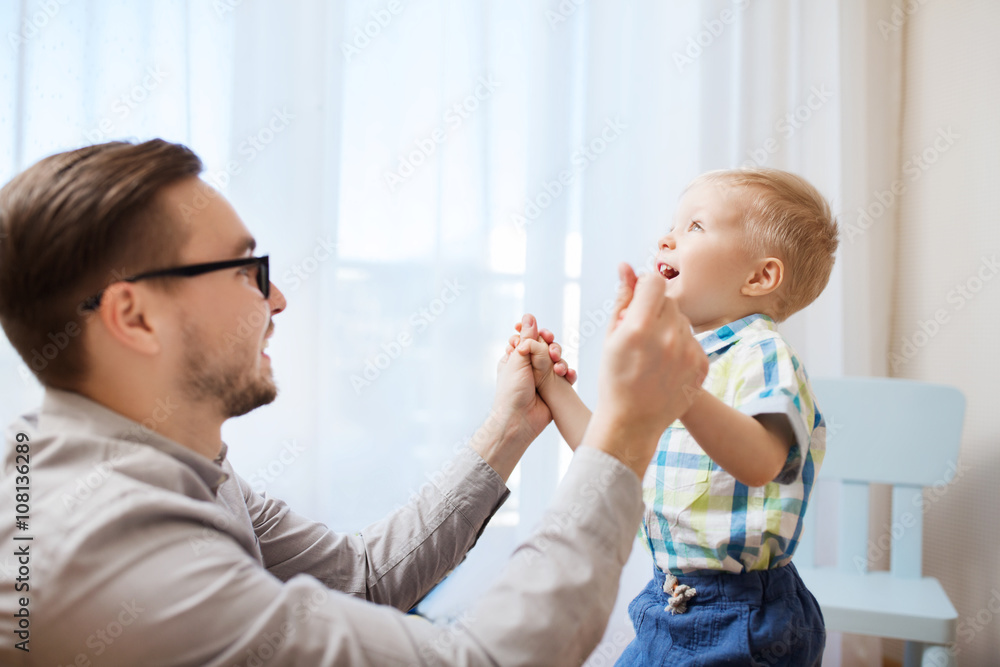 father with son playing and having fun at home