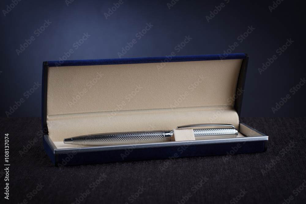 Men's pen in a case against a dark background. Men's pen in a case against a dark background.