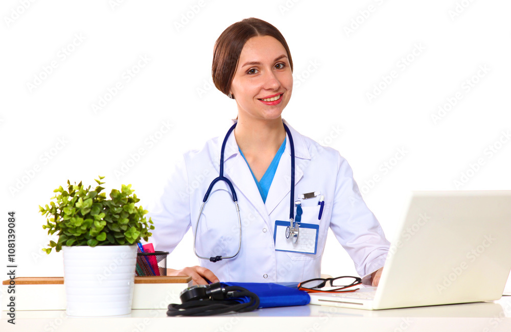 Portrait of young female doctor sitting at desk in hospital Portrait of young female doctor sitting at desk in hospital