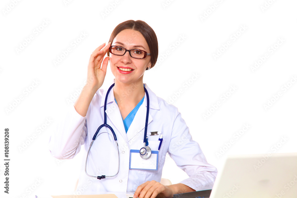 Portrait of young female doctor sitting at desk in hospital Portrait of young female doctor sitting at desk in hospital