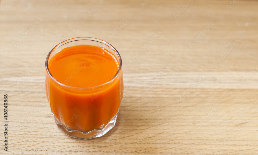 Carrot juice in glass. View from top. Carrot juice in glass. View from top.