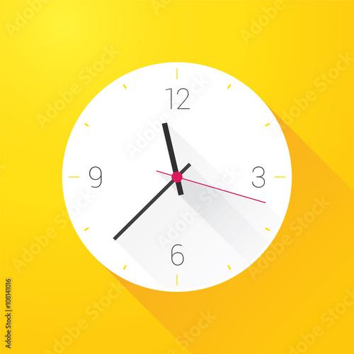 white clock on yellow wall