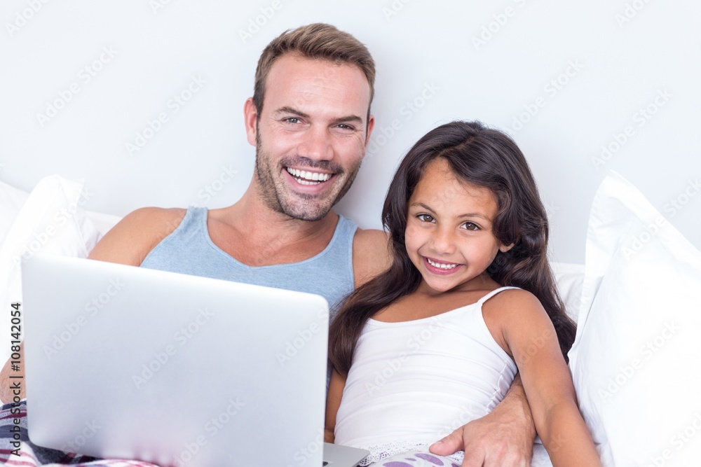 Father and daughter using laptop Father and daughter using laptop