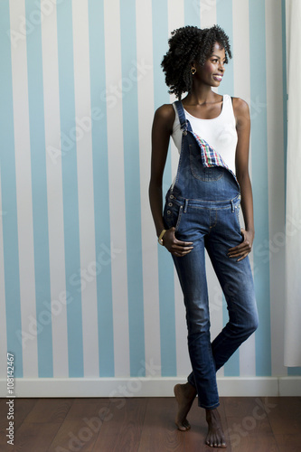 Woman posing by the wall