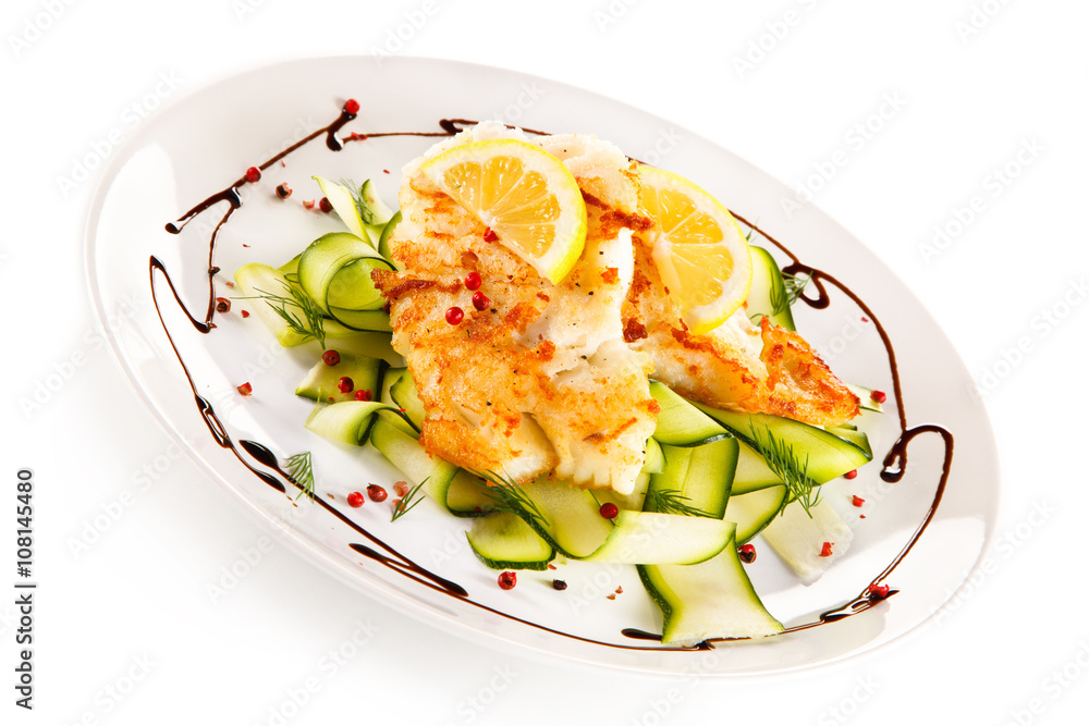 Fish dish - fried cod fillet and vegetables Fish dish - fried cod fillet and vegetables