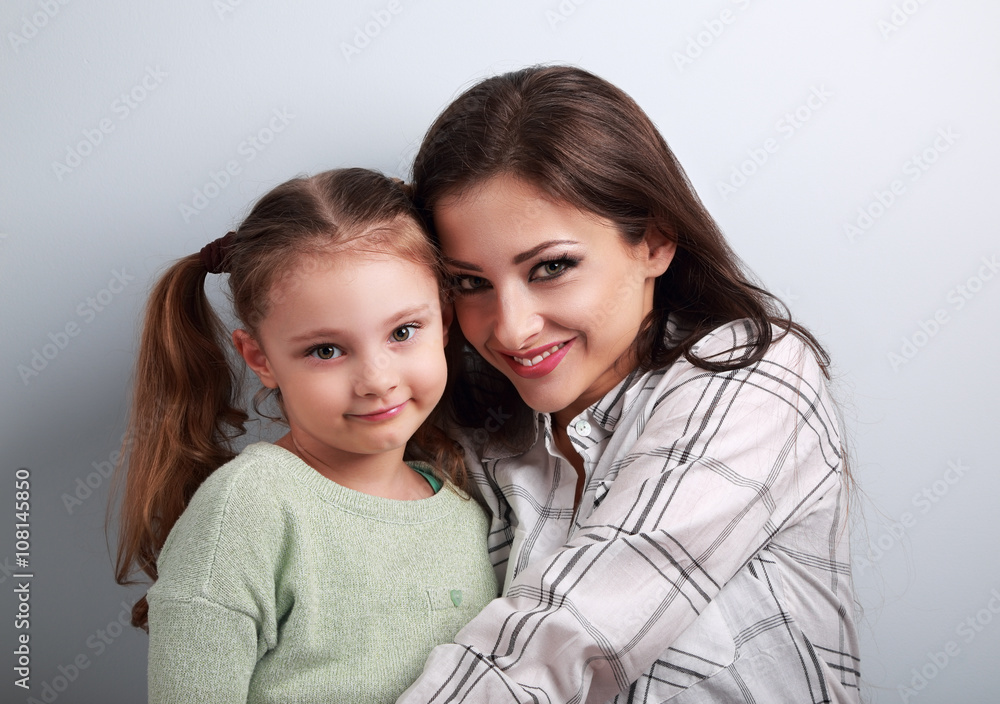 Natural emotional beautiful mother and adorable kid girl hugging Natural emotional beautiful mother and adorable kid girl hugging